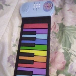 Let's Go Hand Roll Piano For Youth. Battery &  Or DC 9 Volt.